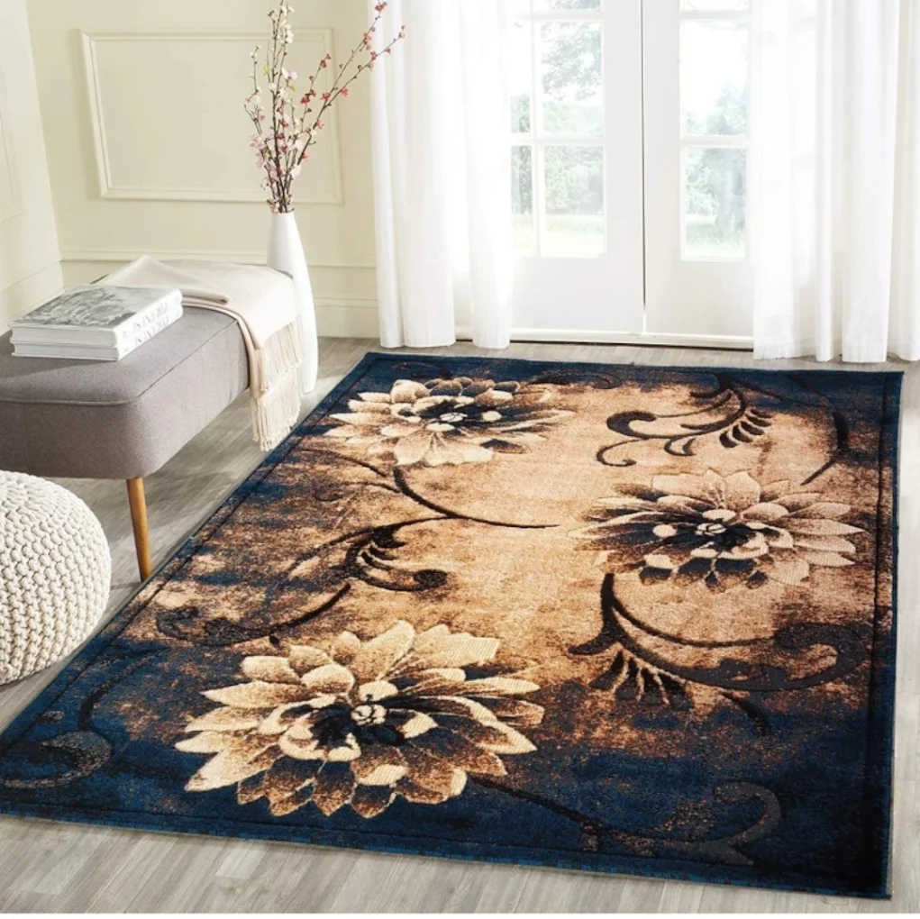 Navy blue and warm gold carpet with three large floral motifs beside a grey bench